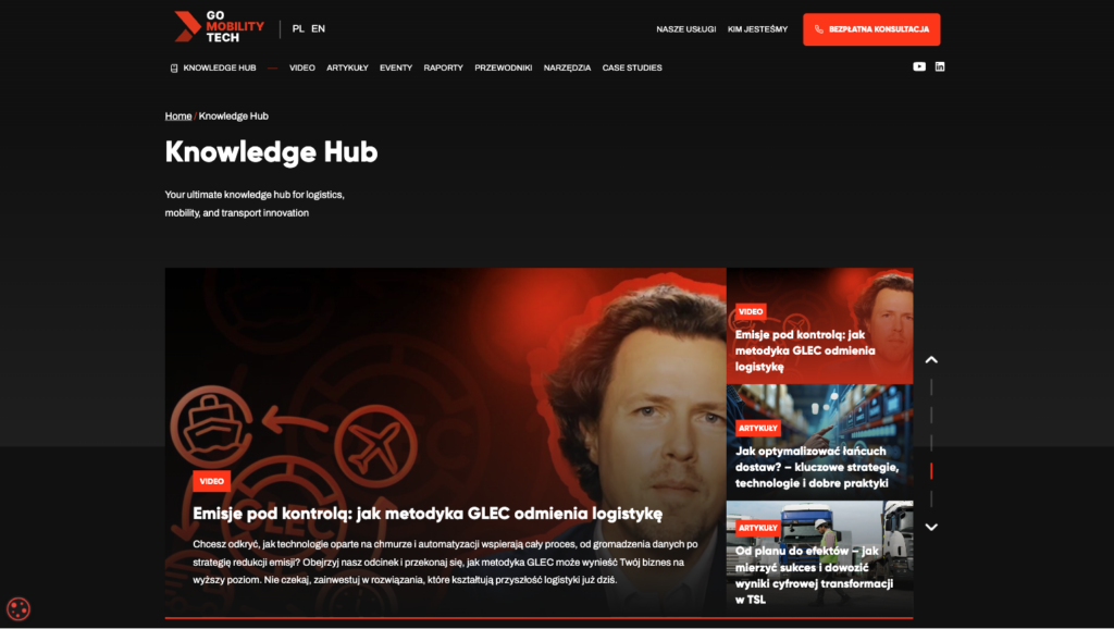 Sekcja Knowledge Hub na stronie Go Mobility Tech z logo firmy i menu nawigacyjnym oraz galerią artykułów logistycznych z tekstem wprowadzającym na ciemnym tle